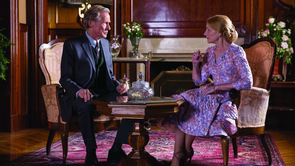 Bill Nighy and Patricia Clarkson sitting at a table, having tea.