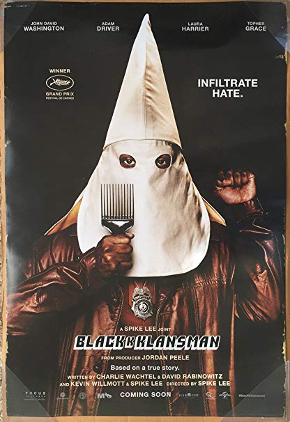The film poster showing a black man in a Ku Klux Klan mask, making a black power fist and holding up a comb.