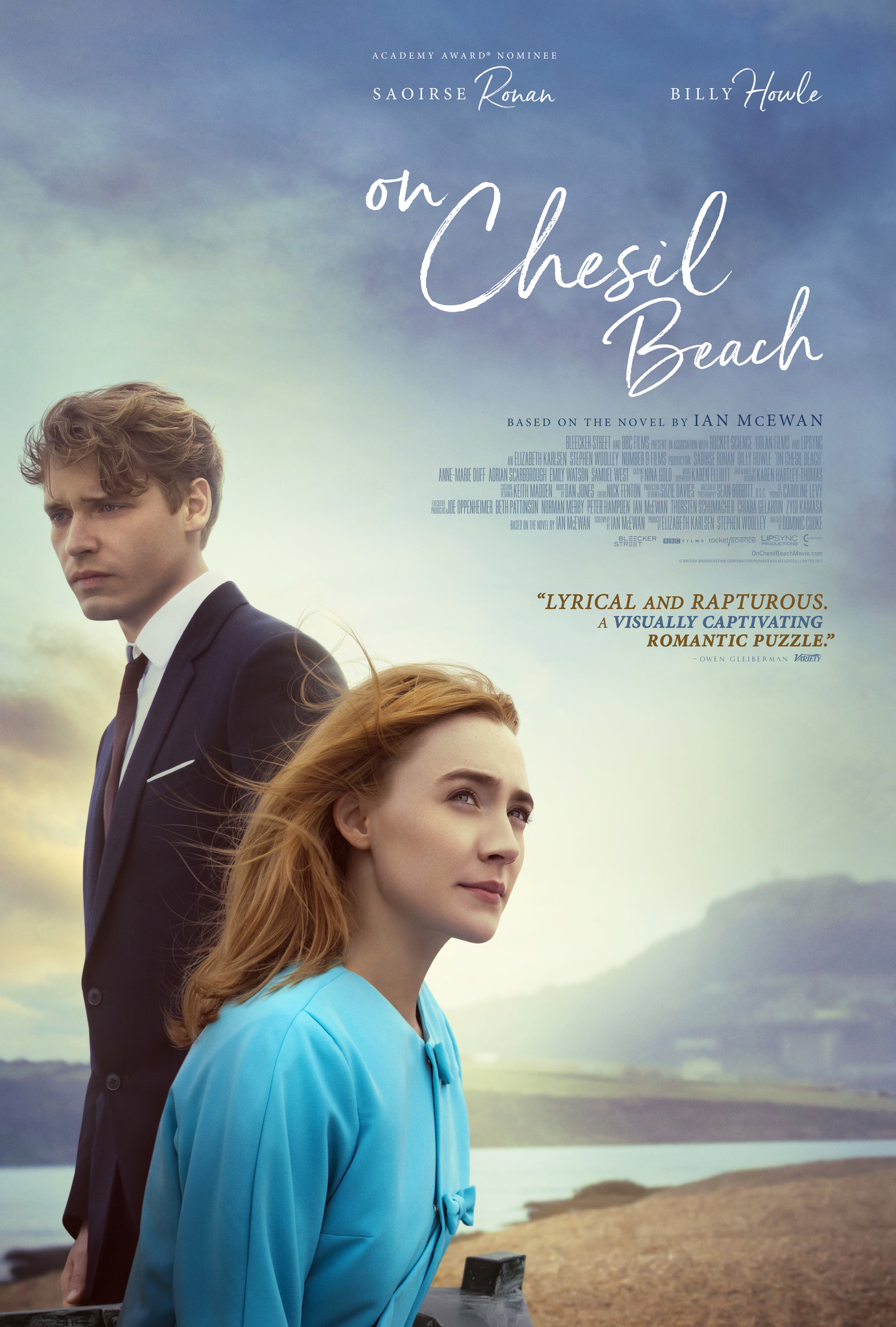 Film poster showing Billy Howle and Saoirse Ronan on a beach, looking in opposite directions.