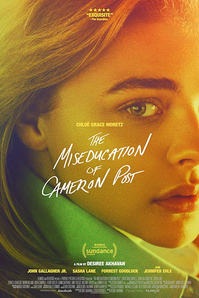 The film poster showing Chloe Grace Moretz' face in close-up, shaded in yellows and greens.