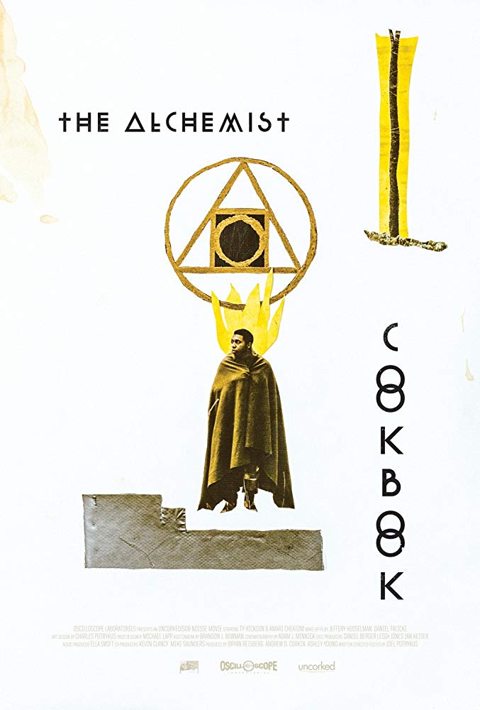 The film poster showing Ty Hickson draped in a blanket and some occult symbols. 