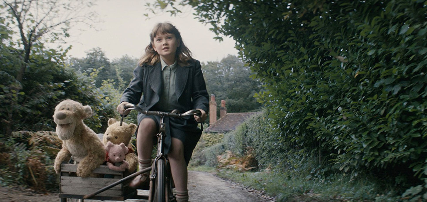 Tigger, Winnie-the-Pooh, Piglet and Bronte Carmichael in the film.