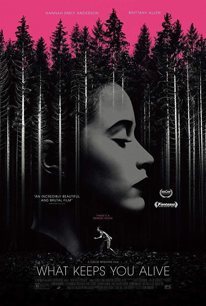 The film poster showing a black and white forest with a woman's face superimposed over it and another woman running through the forest, all under a pink sky.