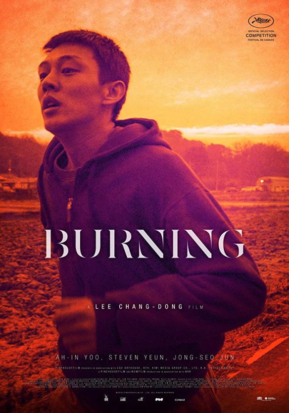 The film poster showing a man in a hoody running through a sunset landscape. 