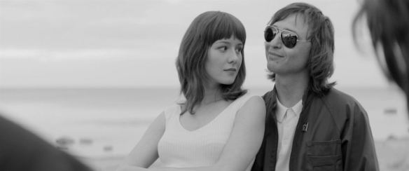 Natalya Naumenko (Irina Starshenbaum) leaning against Mike Naumenko (Roman Bilyk).