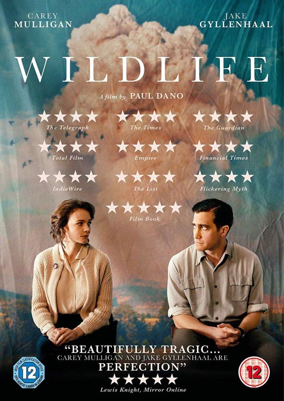 The film poster showing Carey Mulligan and Jack Gyllenhaal sitting apart in front of a canvas showing the sky, looking at each other.