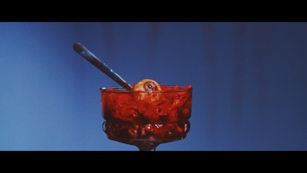 a pudding bowl with a bloody eye in it.