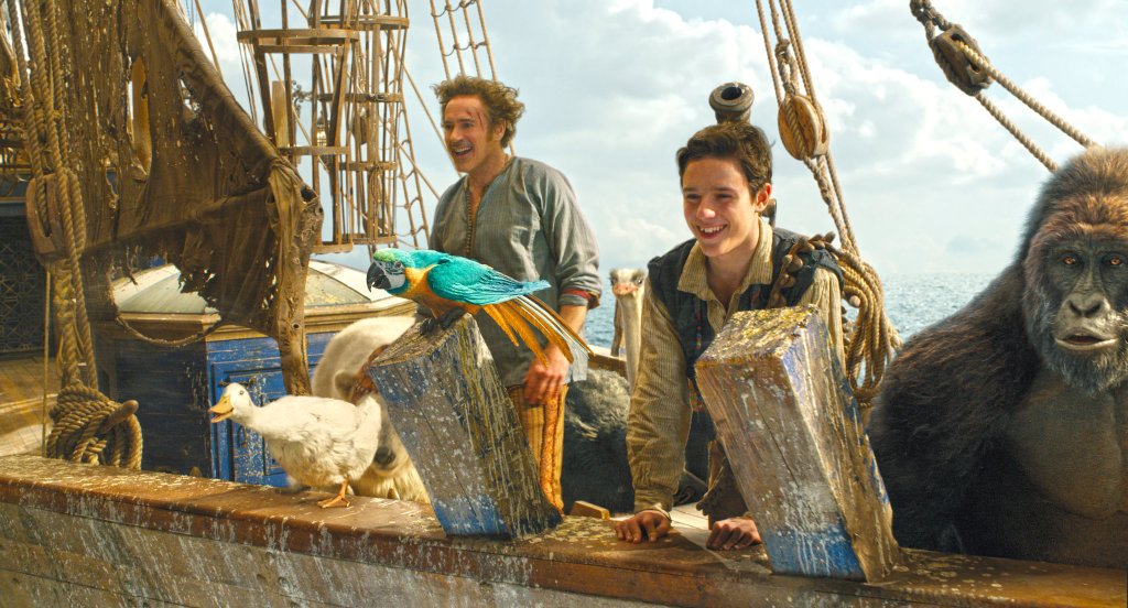 Doctor Dolittle (Robert Downey Jr.) and Tommy (Harry Collett) are sailing with a colorfil mix of animals.