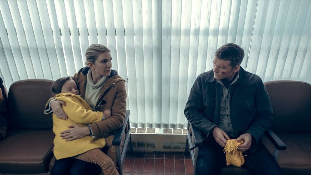 Joanne (Lily Rabe) holding their daughter Peri (Lucy Capri) as she talks to Ray (Sam Worthington) in the hospital's waiting room.