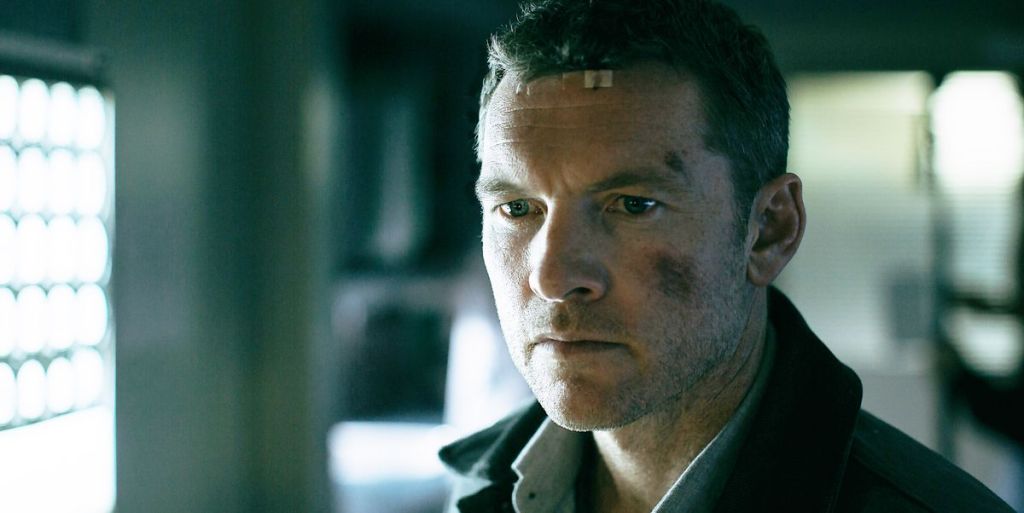 Ray (Sam Worthington) looking banged up and shocked.