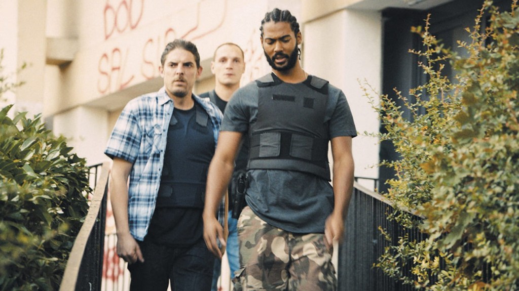 Stéphane (Damien Bonnard), Chris (Alexis Manenti) and Gwada (Djebril Zonga) leaving a house.