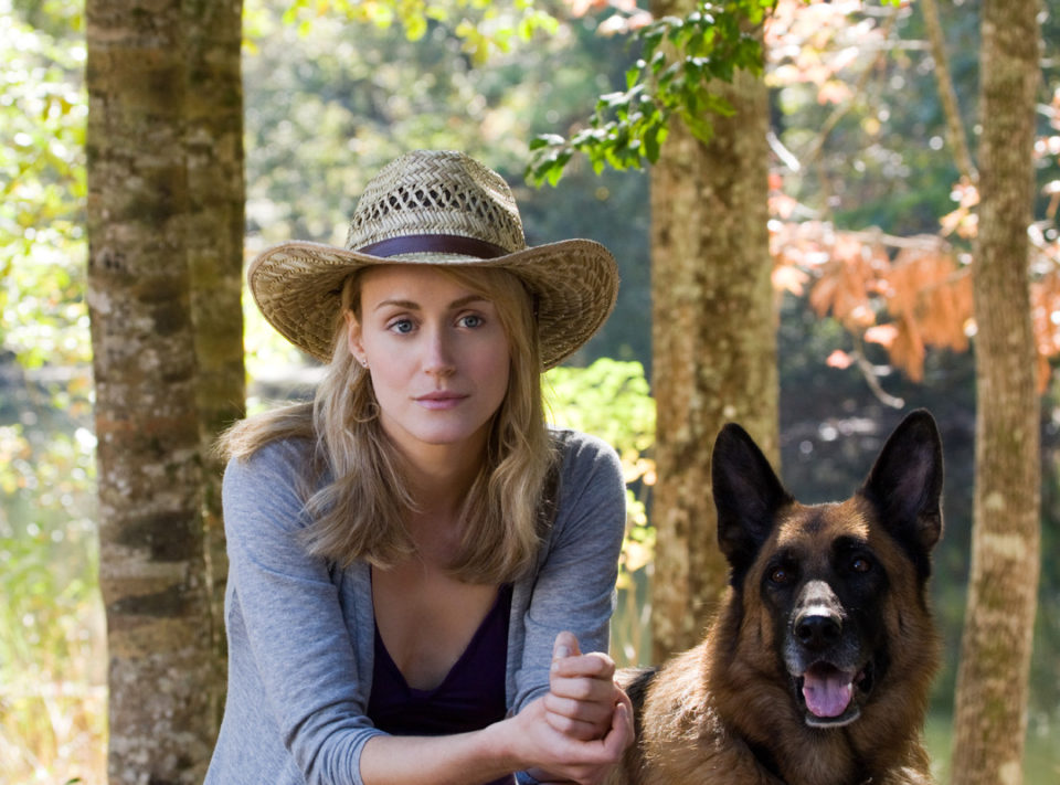 Beth (Taylor Schilling) with a dog.