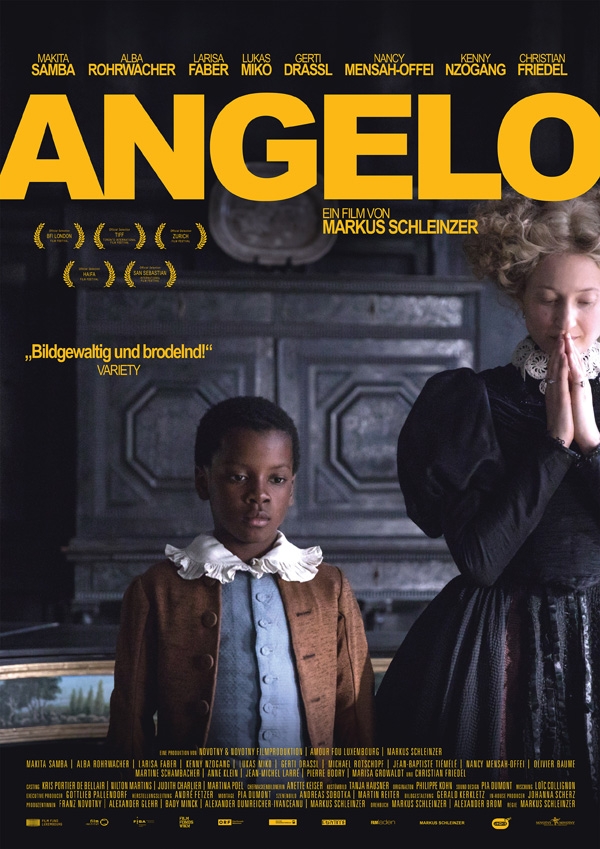Angelo as a child (Kenny Nzogang) and the countess (Alba Rohrwacher) standing next to each other. She's praying.