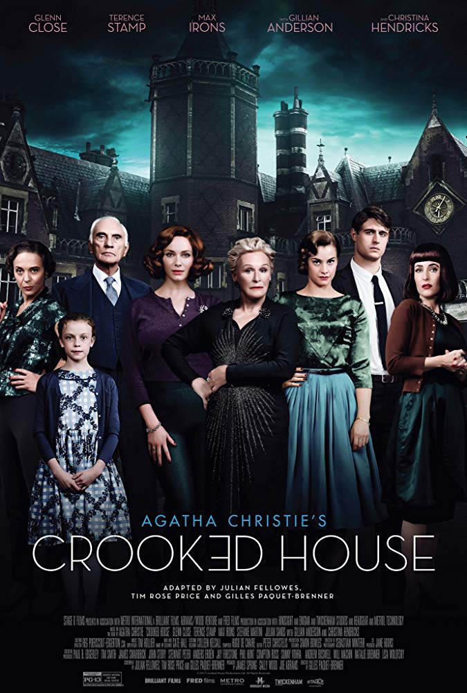 The film poster showing the main characters in front of a dark manor.