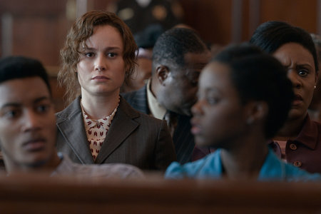 Eva Ansley (Brie Larson) in the public section of the courtroom.