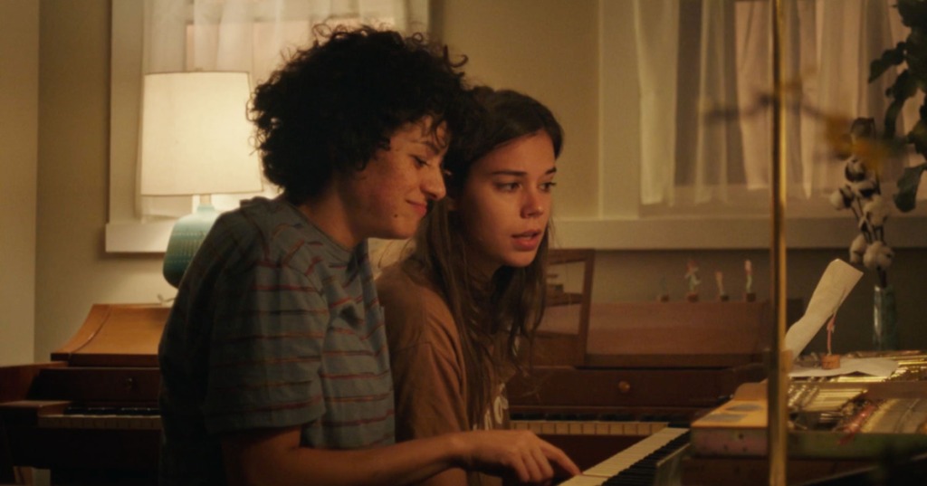 Naima (Alia Shawkat) and Sergio (Laia Costa) playing the piano.
