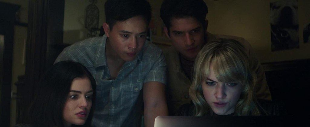 Olivia (Lucy Hale), Brad (Hayden Szeto), Lucas (Tyler Posey) and Markie (Violett Beane) looking at a computer screen.