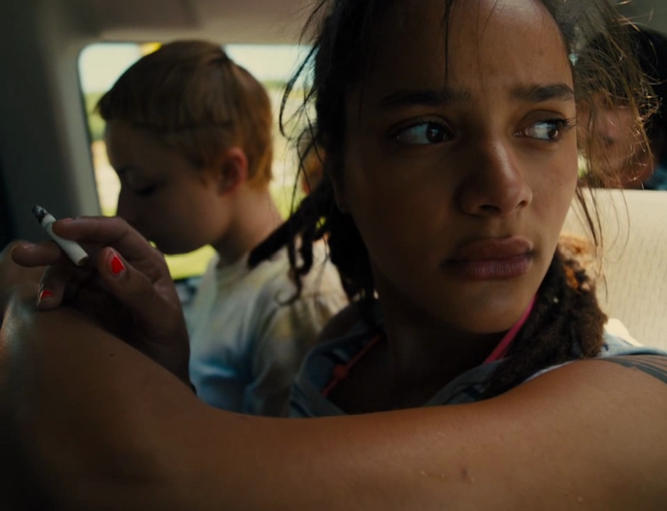 Star (Sasha Lane) looking out the car window.