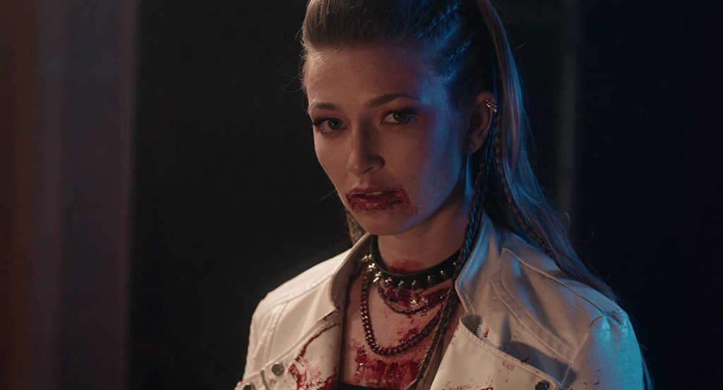 Duke (Daina Hopper) with a bloody mouth.