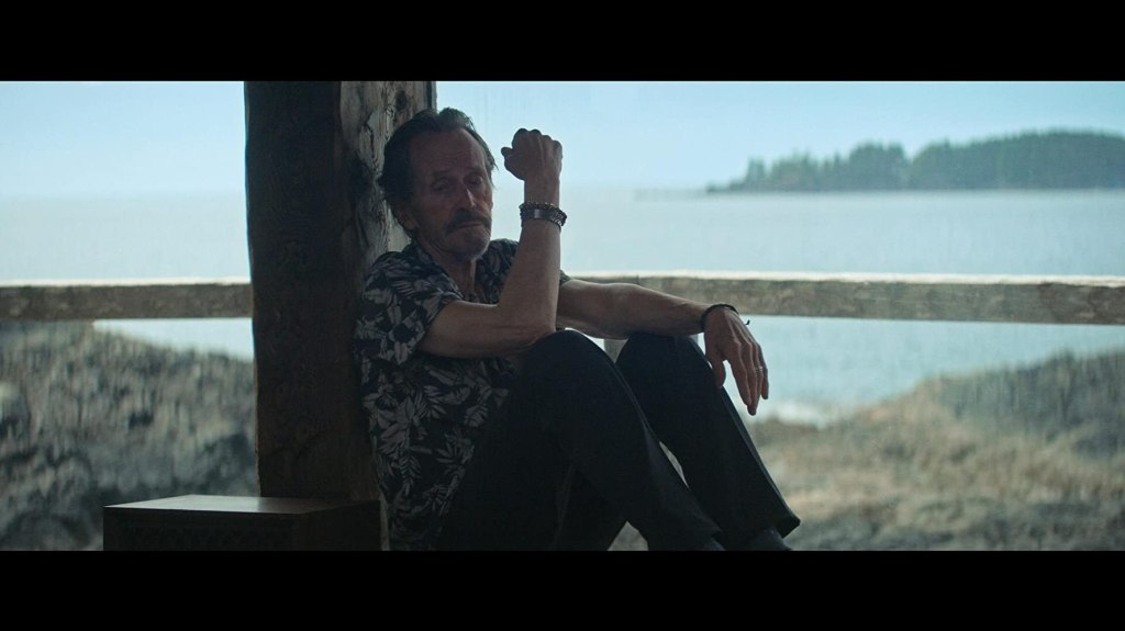 Gordon (Stephen McHattie) sitting on the porch, looking tired.