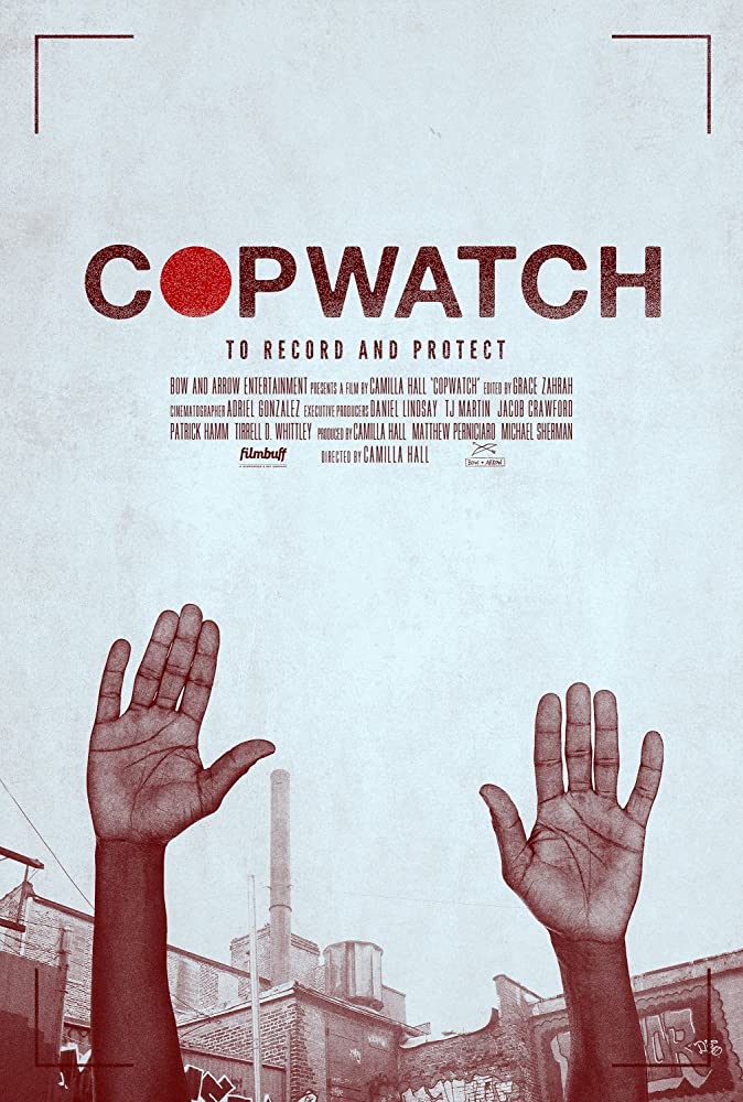 The film poster showing the hands of a Black person raised high. 