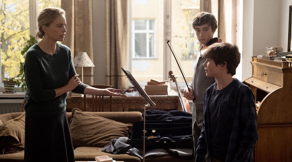 Anna (Nina Hoss) working with her student Alexander (Ilja Monti) and her son Jonas (Serafin Mishiev).