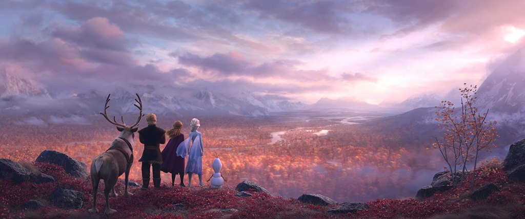 Sven, Kristoff, Anna, Elsa and Olaf overlooking a valley in fall. 