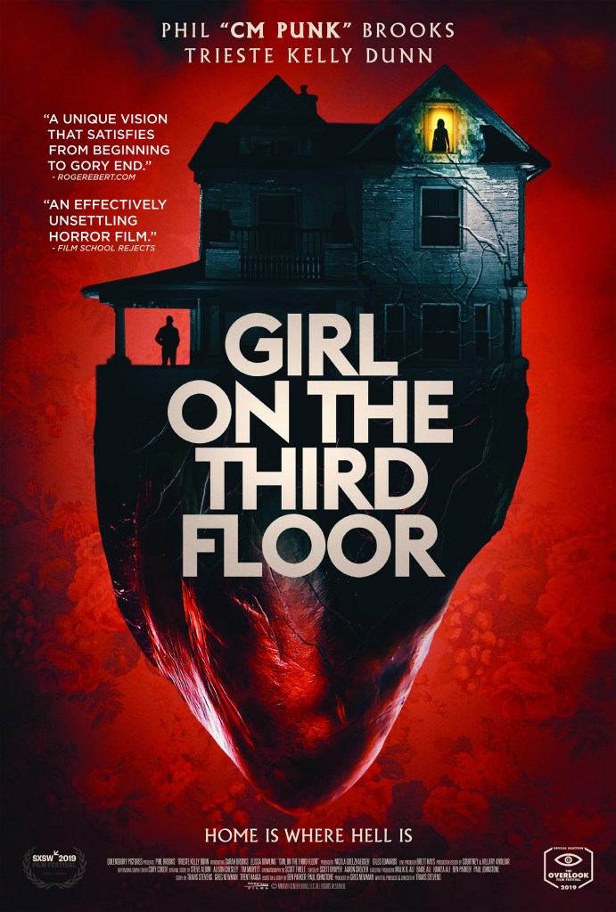 The film poster showing the house in front of a red background. The basement is shaped like the bottom half of a heart.