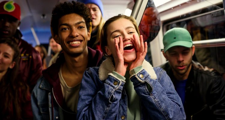 Katya (Alexandra Pfeifer) and Marlon (Yalany Marschner) watch their friends dance.