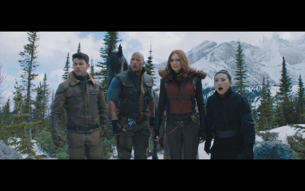 Seaplane (Nick Jonas), Bravestone (Dwayne Johnson), Ruby (Karen Gillan) and Ming (Awkwafina) in a snowy landscape.
