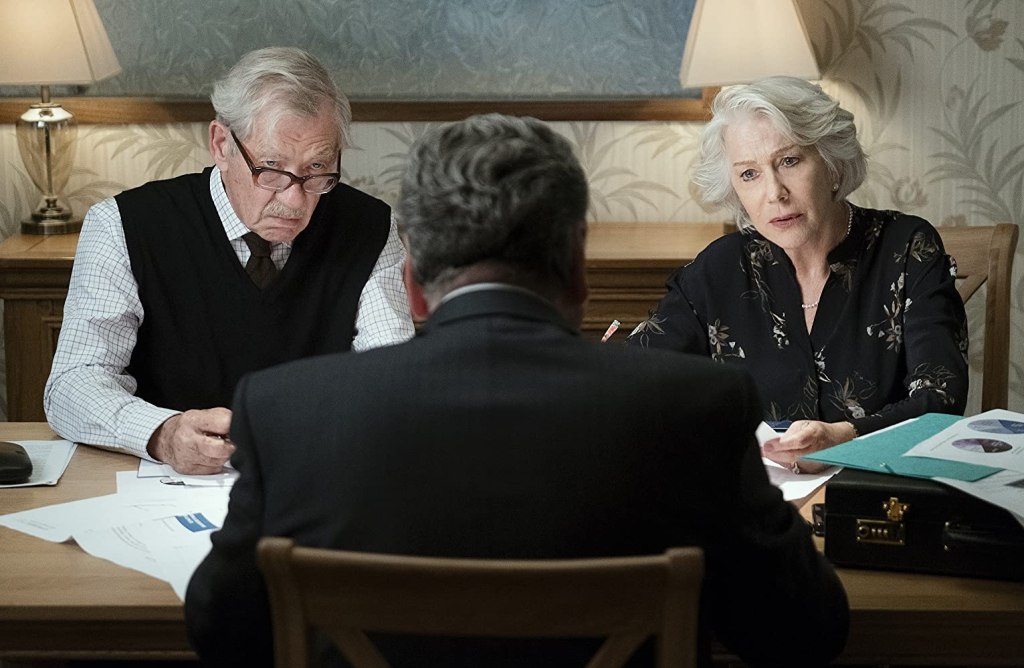 Betty (Helen Mirren) and Roy (Ian McKellen) going over some documents.