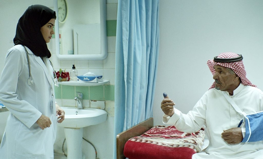 Maryam (Mila Al Zahrani) treating a patient.