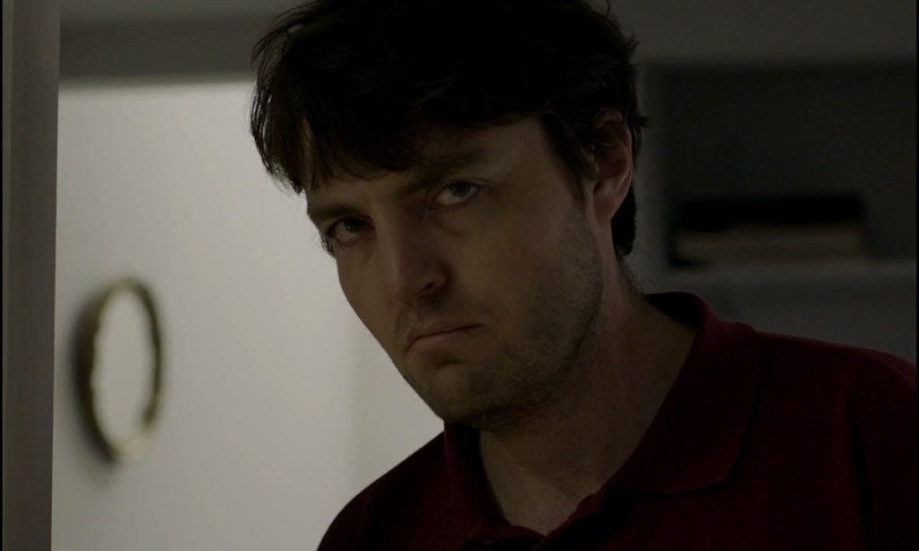 Anthony (Tom Burke) looking dishevelled. 