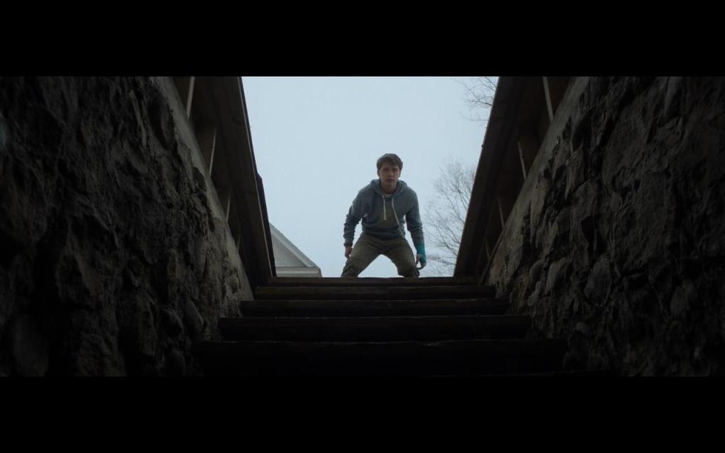 Ben (John-Paul Howard) investigating his neighbors' cellar.