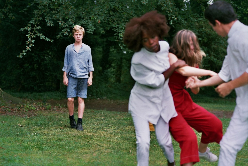 Paul (Thomas Gioria) watches as Gloria (Fantine Harduin) is carried away by two orderlies.