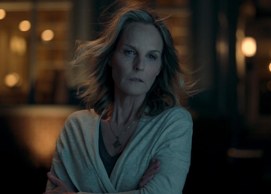 Jackie (Helen Hunt) standing outside at night.