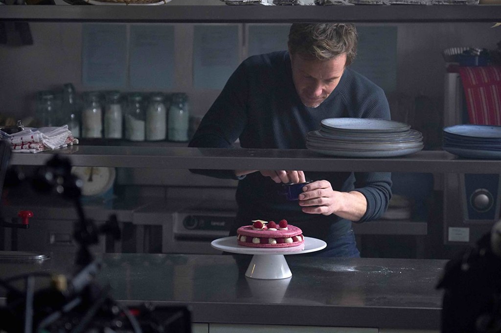 Matthew (Rupert Landry-Jones) baking a beautiful fancy cake.