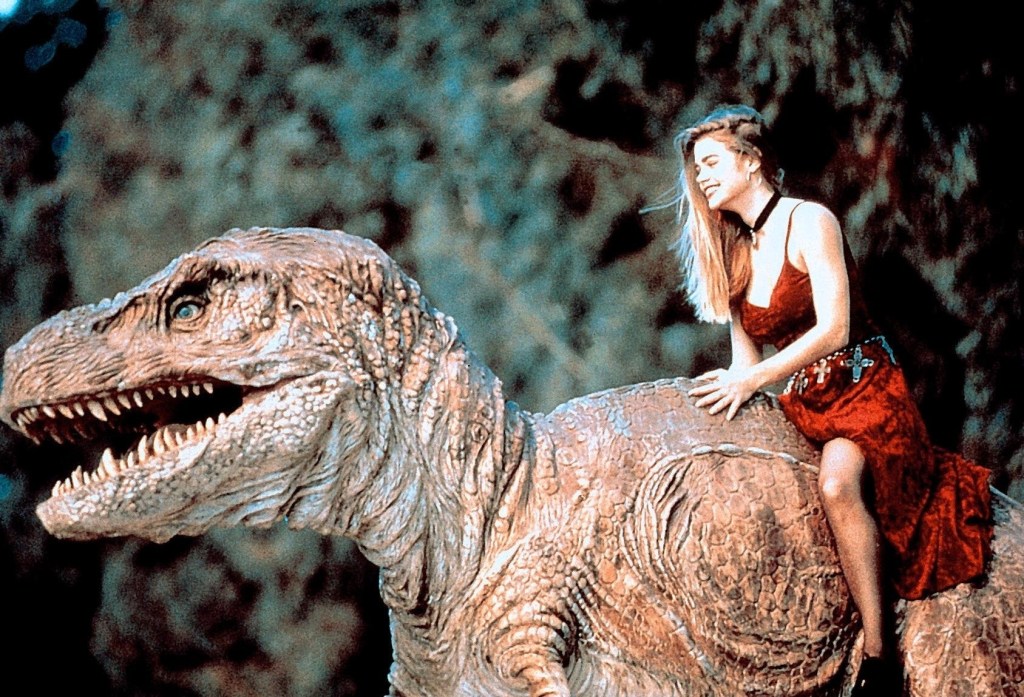 Tammy (Denise Richards) rides Michael (Paul Walker) in T-Rex form. 