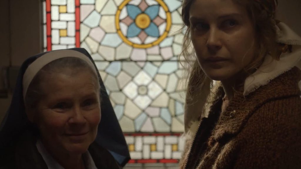 Sister Claire (Imelda Staunton) talking to Magda (Carla Juri).