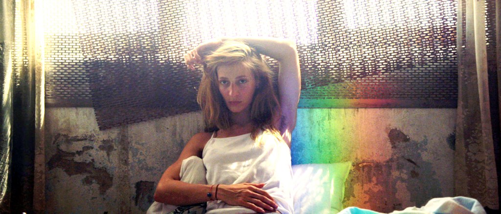 Ayse (Billur Melis Koç) in bed at her boyfriend's apartment.