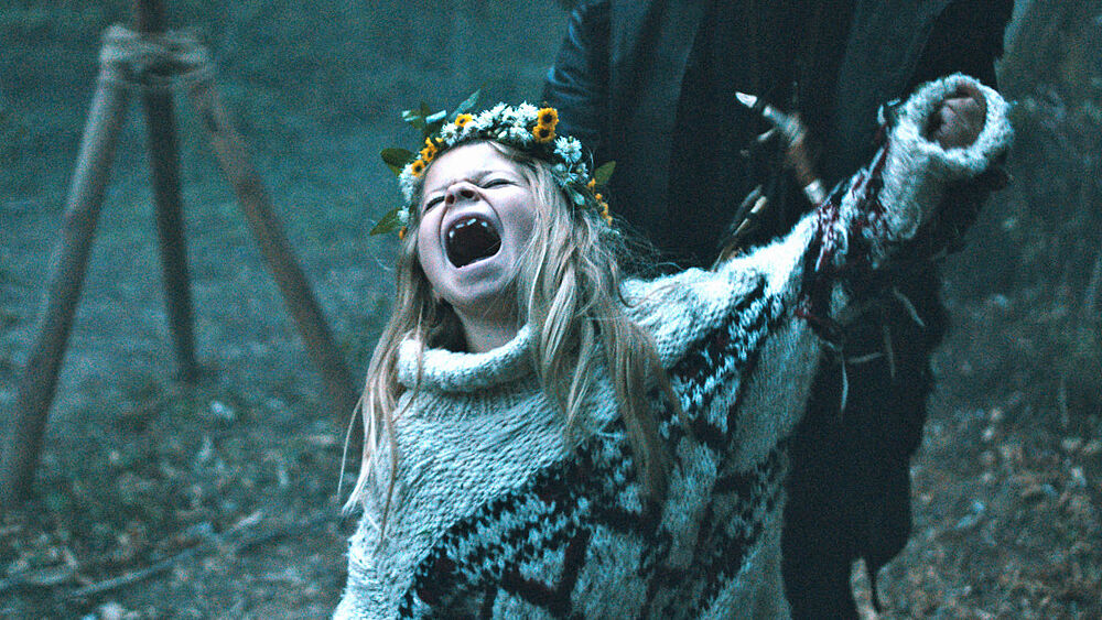 Raya (Katerina Lipovska) screaming at the top of her lungs.