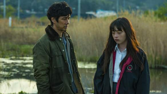 Haru (Serena Motola) and Morio (Hidetoshi Nishijima) at the place where Haru's house used to stand.