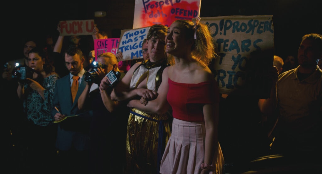 Ferdinand (Erin Patrick Miller) and Miranda (Kate McGarrigle) at a protest.