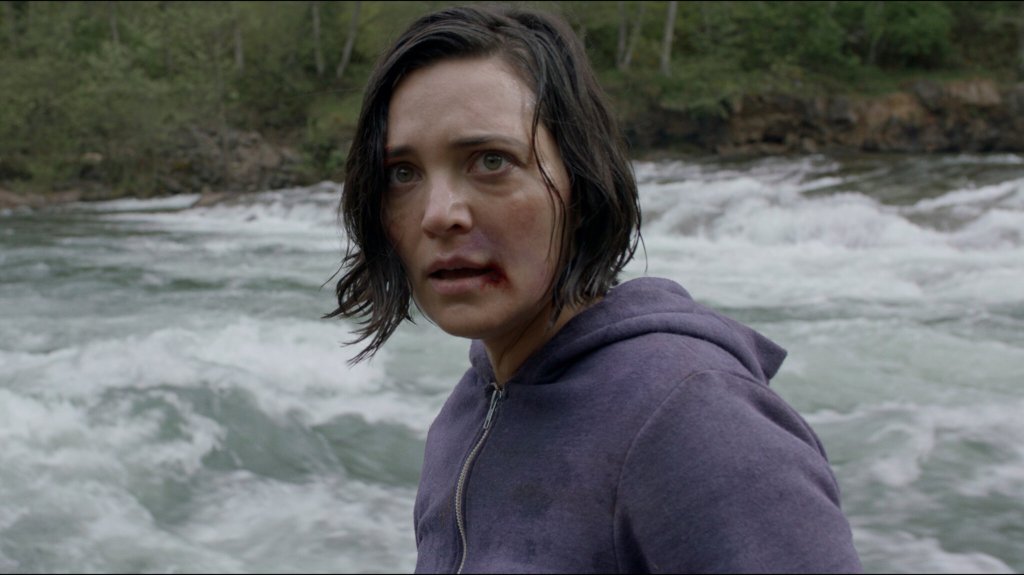 Jessica (Jules Willcox) at the edge of a river.