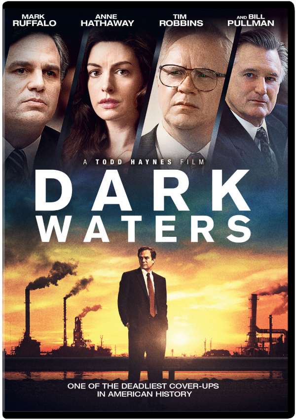 The film poster showing Rob Bilott (Mark Ruffalo) standing in front of a chemical plant. At the top of the poster we can see Rob Bilott, his wife Sarah (Anne Hathaway), his boss Tom Terp (Tim Robbins) and second lawyer Harry Dietzler (Bill Pullman).
