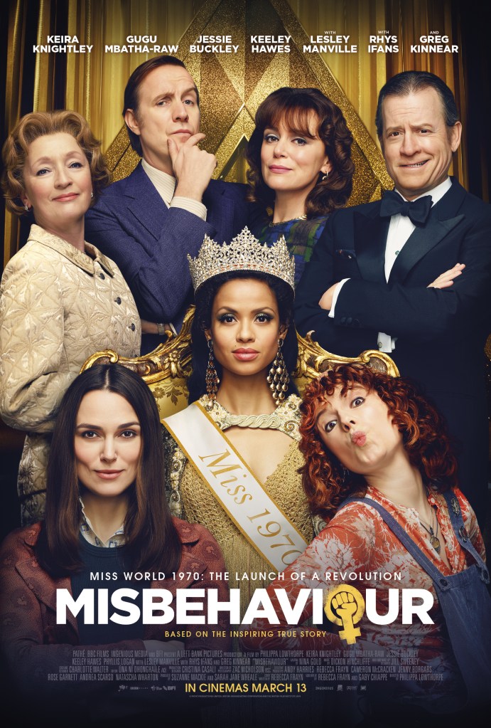 The film poster showing Jennifer Hosten (Gugu Mbatha-Raw) seated on a throne, Sally (Keira Knightley) and Jo (Jessie Buckley) in front of her and Dolores Hope (Leslie Manville), Eric Morley (Rhys Ifans), Julia Morley (Keeley Hawes) and Bob Hope (Greg Kinnear) behind them. 