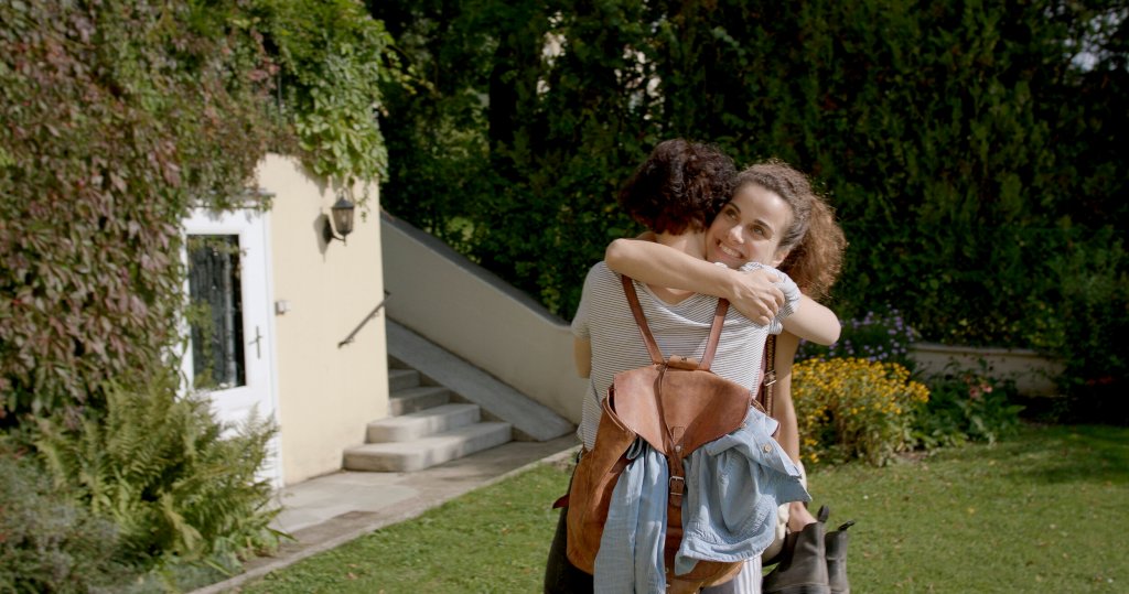 Matilda (Clara Diemling) and Aurora (Elisabeth Kanettis) hug as they meet up.