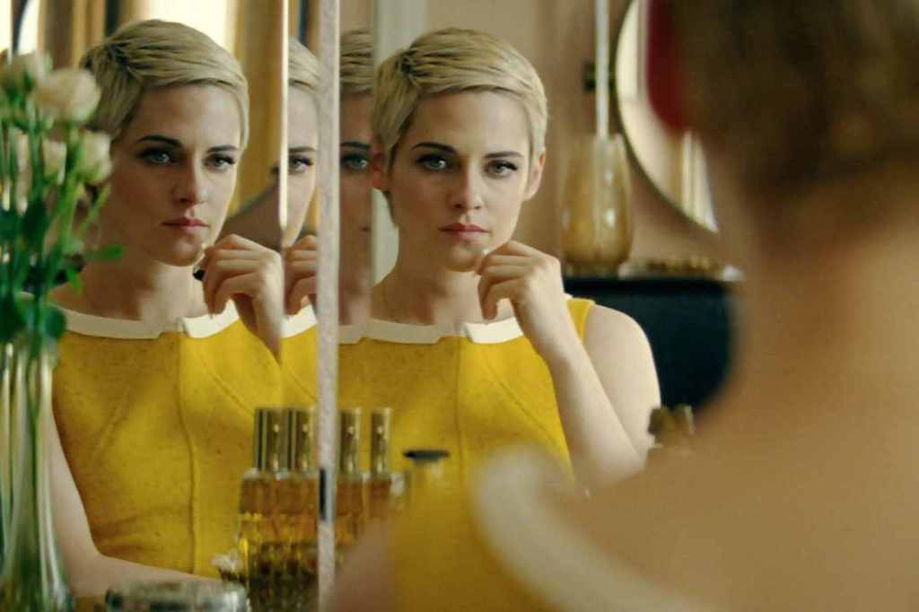 Jean Seberg (Kristen Stewart) looking at herself in a mirror.