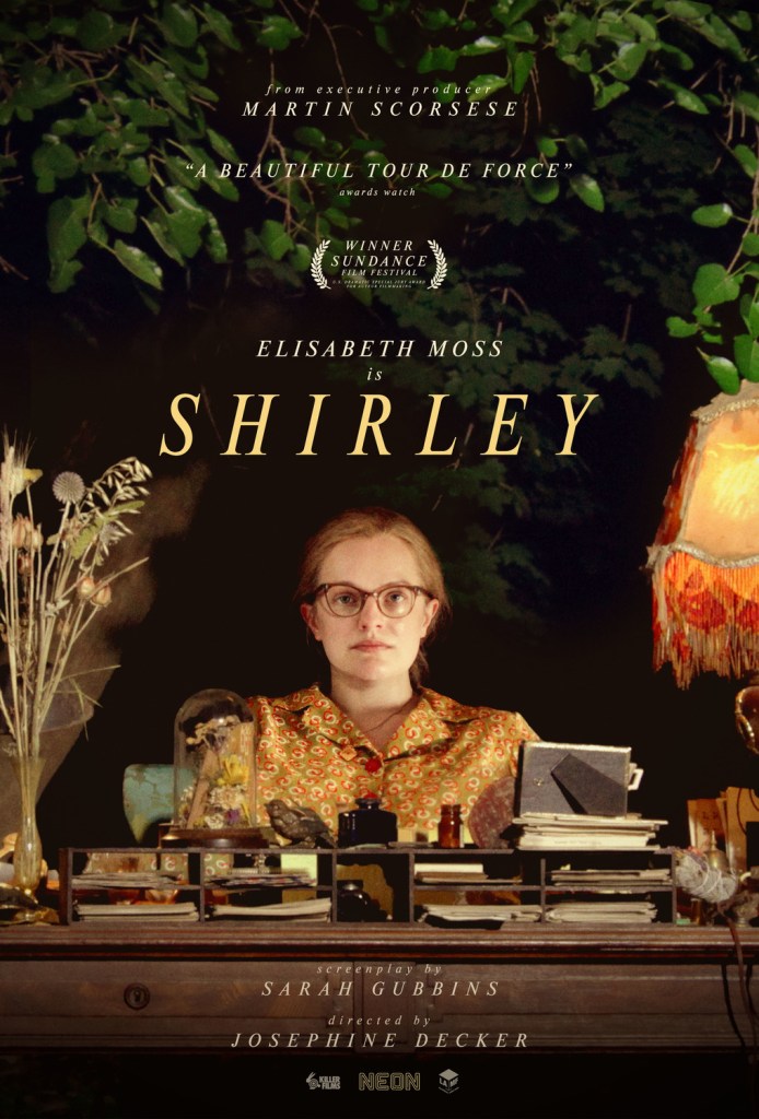 The film poster showing Shirley Jackson (Elisabeth Moss) sitting at a desk in the middle of the woods.