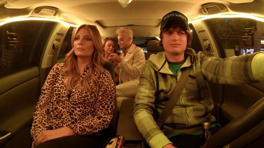 Kurt (Joe Keery) driving London (Mischa Barton) and her friends. 